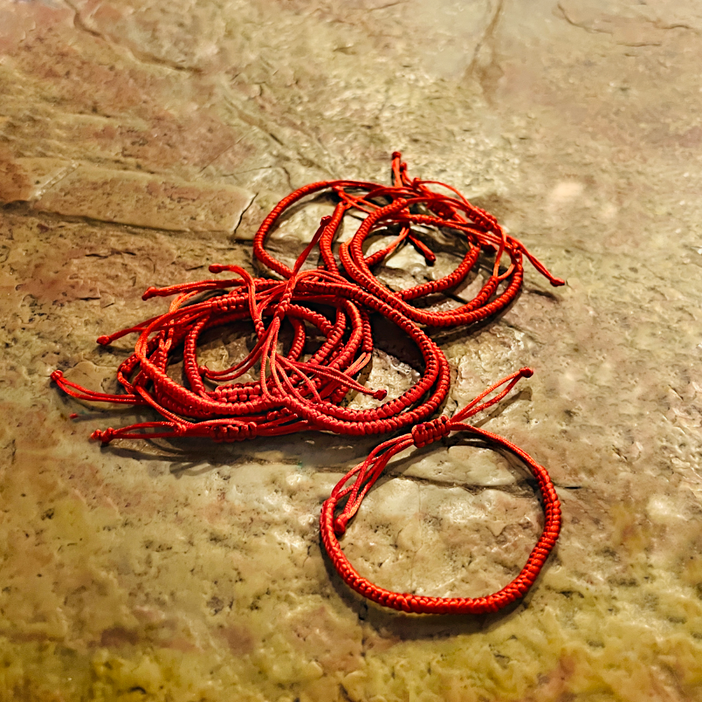 White bracelet with cross