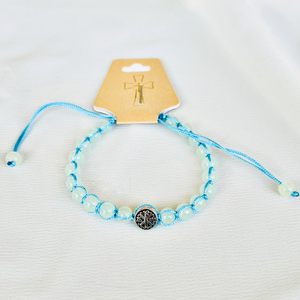 White bracelet with cross