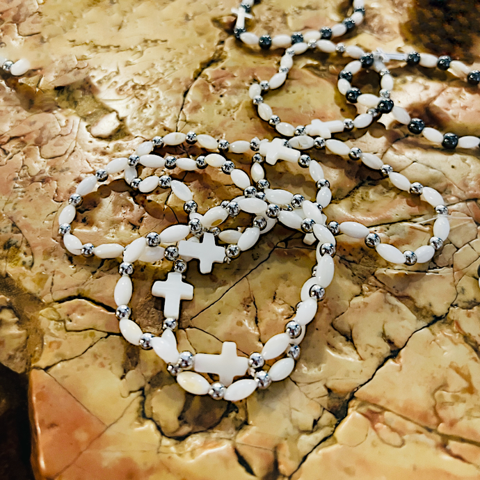 White bracelet with cross